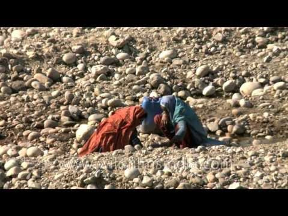 Water scarcity forces women to carry water long distances at Rajaji National Park