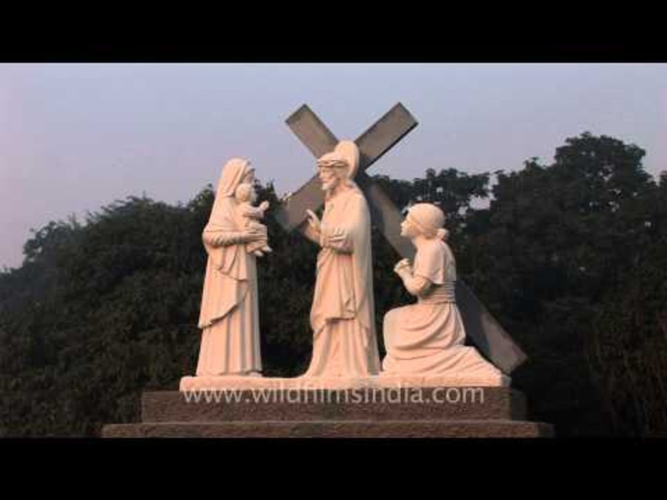 Statues depicting the station of the cross at t...