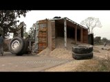 Truck - bus accident causes grain to spill onto road