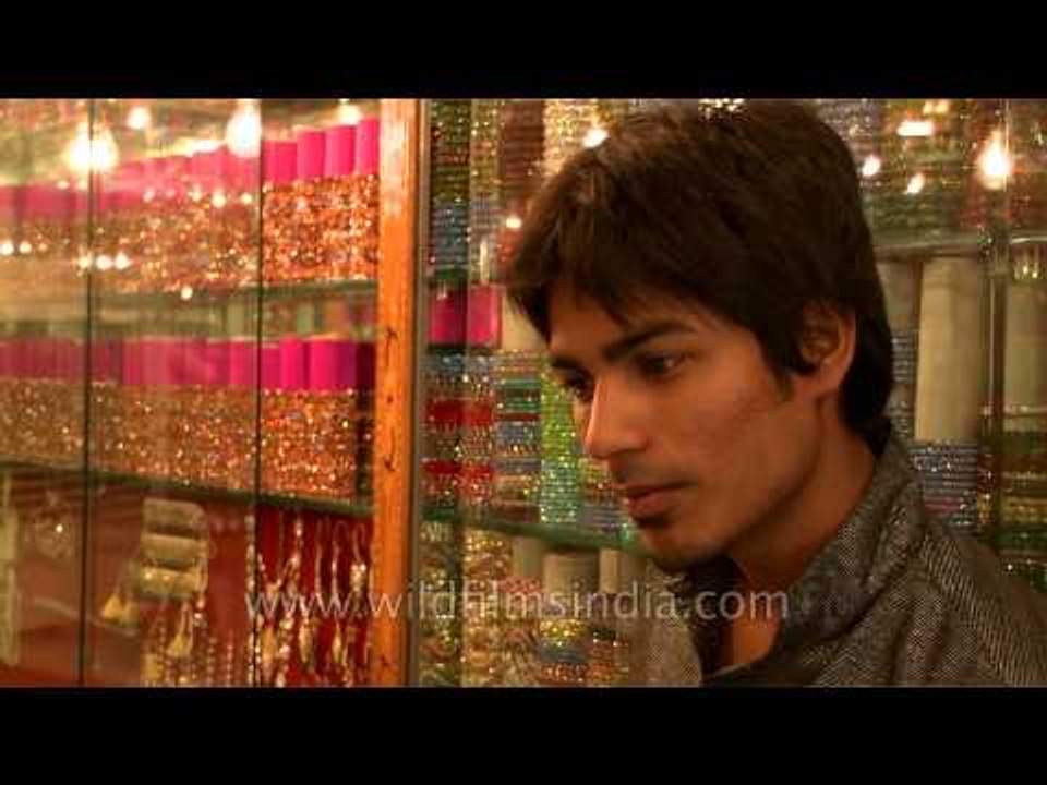 Glistening bangles tease the feminine.