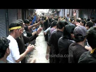 Shia Muslim man wears Facebook T-shirt and beats chests on Ashura!