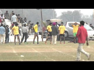 Rural olympics racers warm up on the track before the start