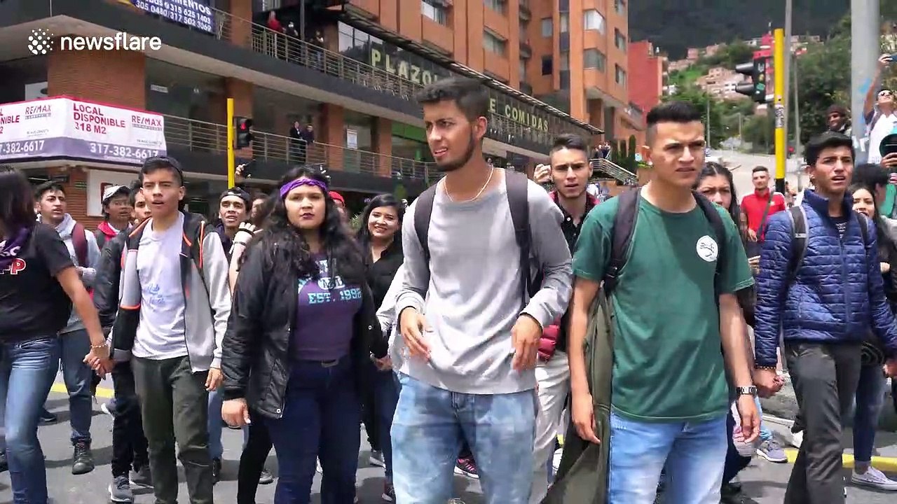 Protesters clash with riot police during nation-wide strike in Colombia