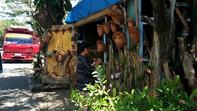Indonesian man carves washed up coconuts and driftwood into amazing crafts