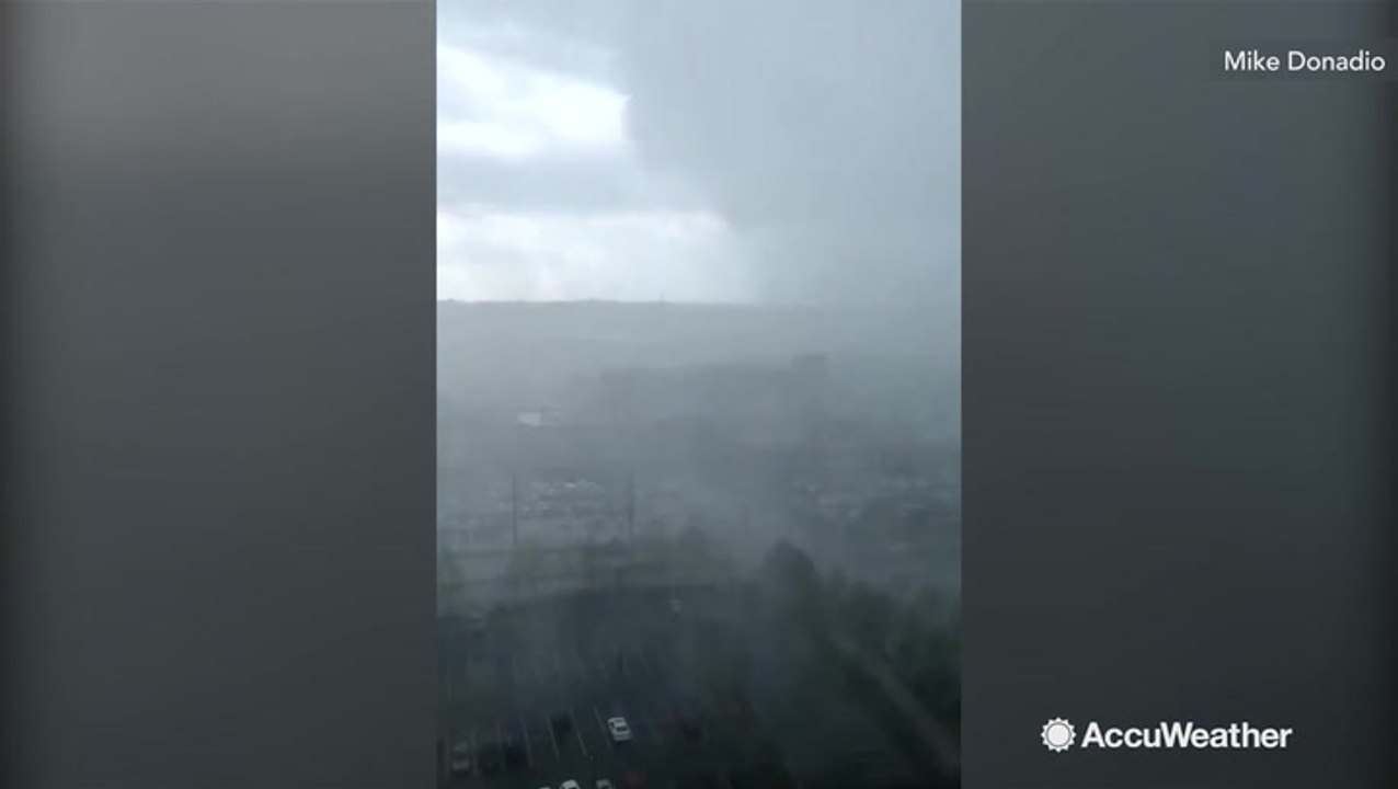 Timelapse of storm drenching town in rain