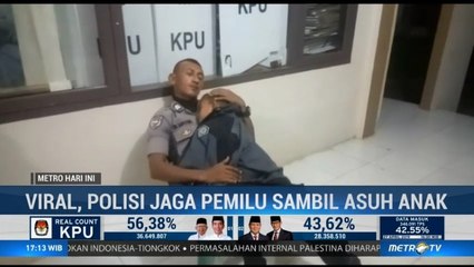 Viral, Polisi Jaga Pemilu Sambil Asuh Anak
