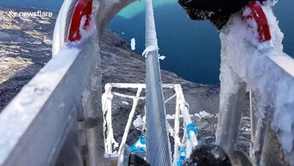 Hypnotic cable reel shears ice off powerlines in Greenland