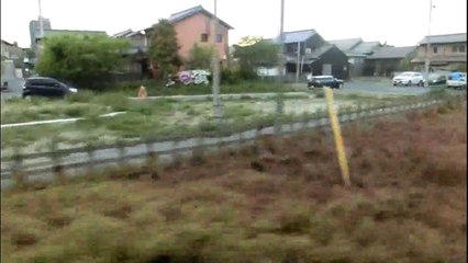 （taoyakaibs）車窓から夕日に映える町並みCityscape that shines in the setting sun from a train window