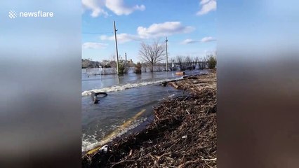 Flooding turns Canada car park into beach complete with tidal debris
