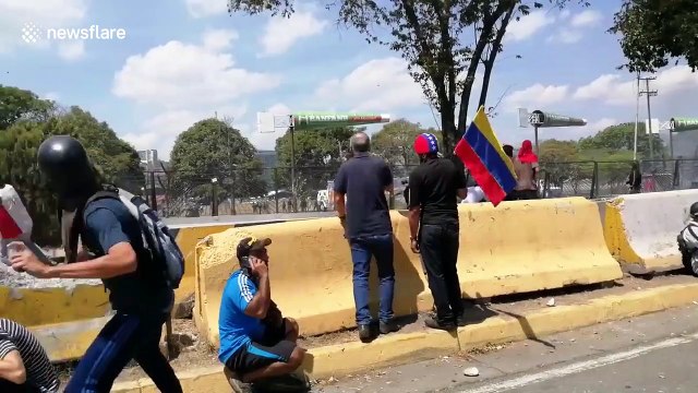 Military vehicle fires on civilians in Caracas clashes