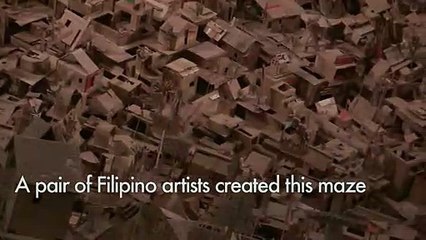 Intricate cardboard city rises in Manila art show