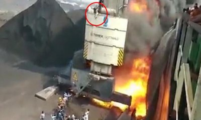 Yanan vinçte mahsur kalan işçi 15 metreden atladı