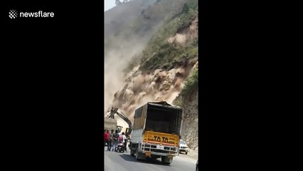 Terrifying moment motorists cheat death in landslide in Northern India