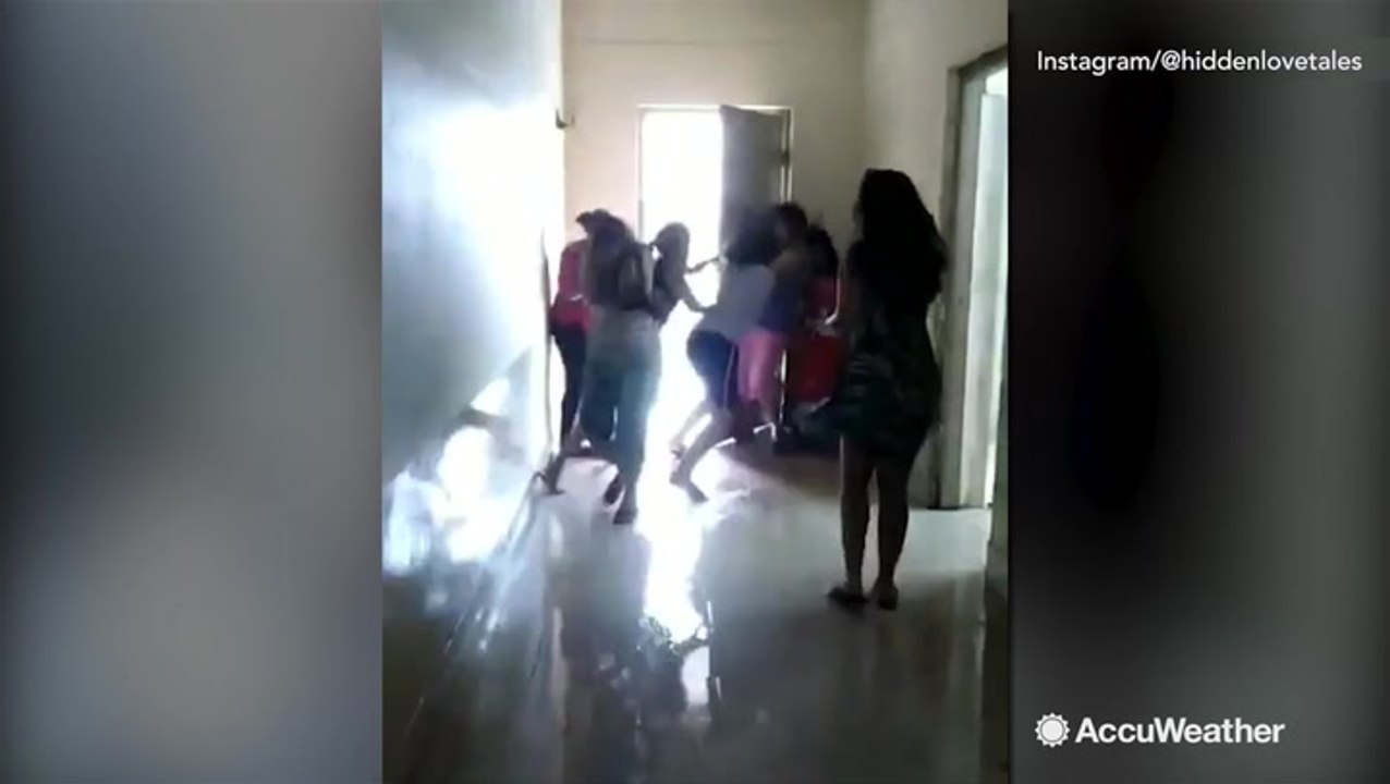 Cyclone Fani's winds too much for people trying to keep door closed