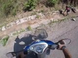 Biker Trying to High Five Biker Friend Falls in Ditch