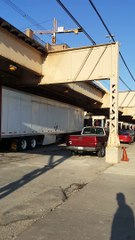 Semi Driver Tries to Pass Under Low Clearance Bridge, Fails