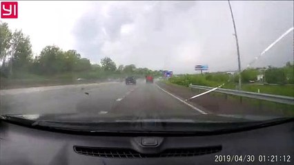 Driver Deftly Dodges Fallen Wheelbarrow