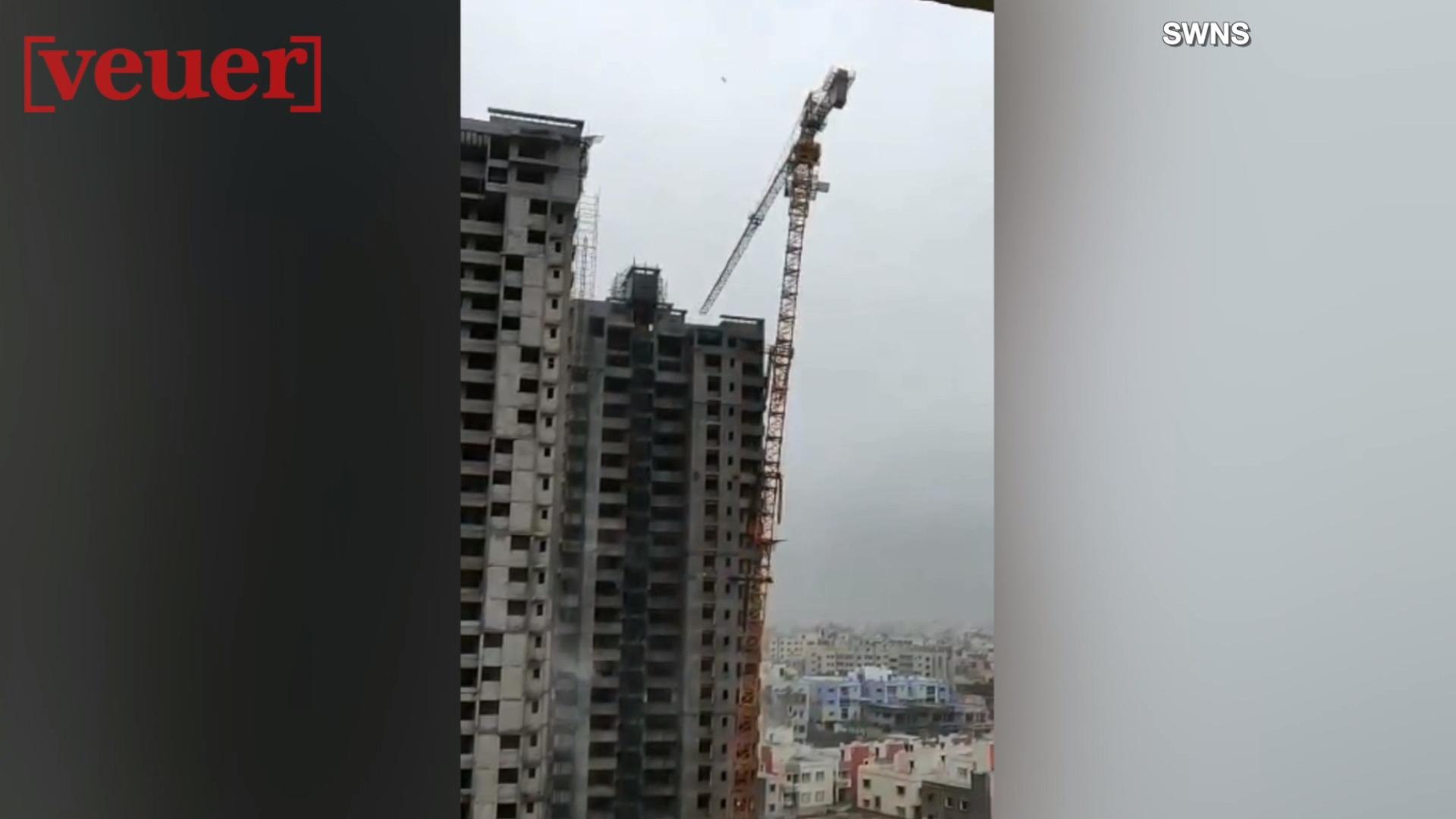 ⁣Video Shows High Winds Toppling Crane; Crushing Houses Below