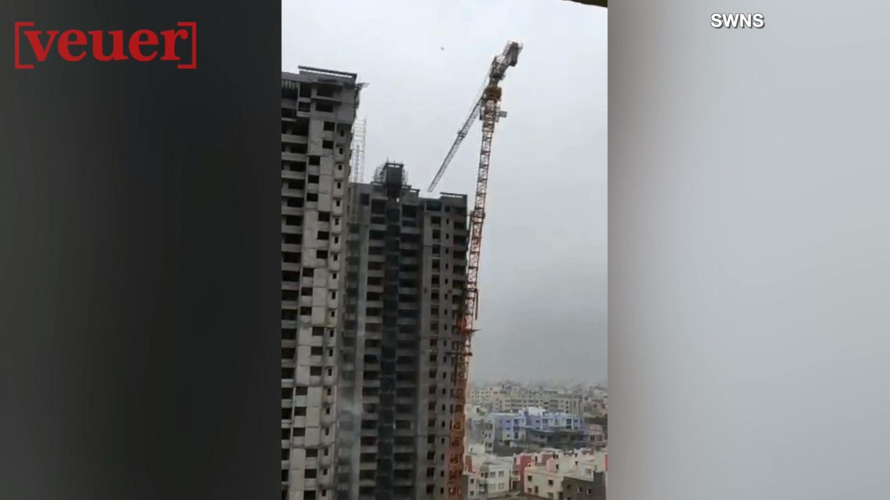Video Shows High Winds Toppling Crane; Crushing Houses Below