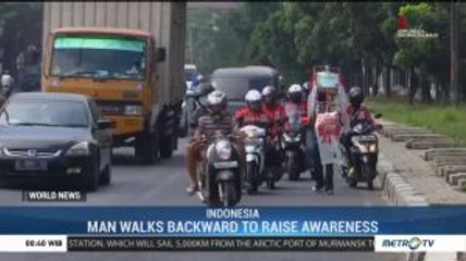 Man Walks Backward to Raise Awareness