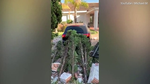 Irish boy smashes through wall after loosing control of dad's car