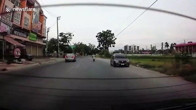 Moped rider in Thailand smashes 'rear windscreen with his head' then rides off
