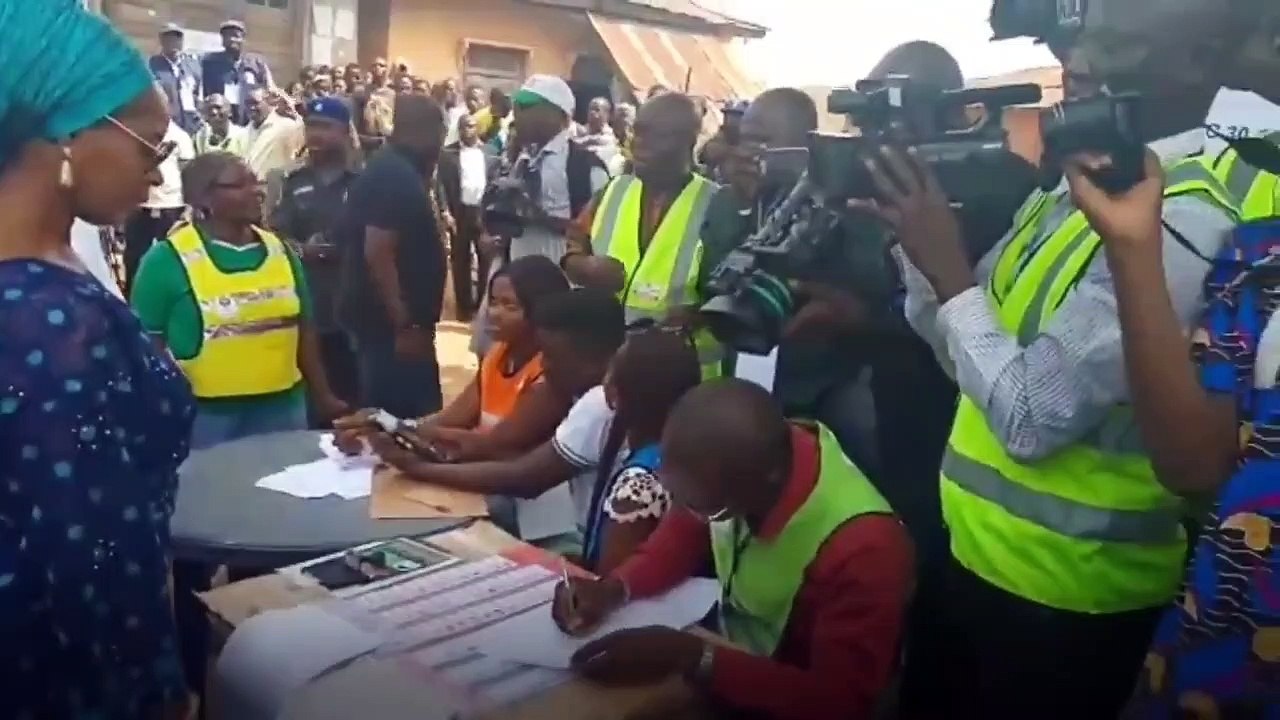 A large crowd watch and cheer as Ogun State governor Senator Ibikunle Amosun ...