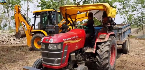 Backhoe Loading Stone in Tractor(1)