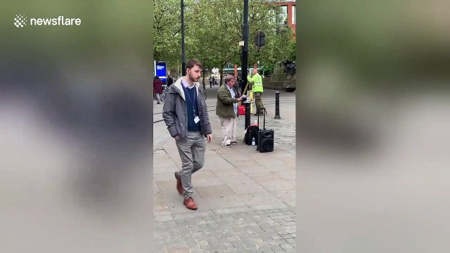 Preachers in Manchester argue across the street in 'Christian Soundclash'