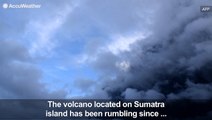 Volcano spews ash and smoke thousands of feet into the air