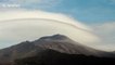 Spectacular footage of lenticular clouds moving over Mount Etna volcano