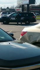 Detained Man Flees in Stolen Police Car