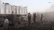 Mosul's children scavenge through rubbish to survive