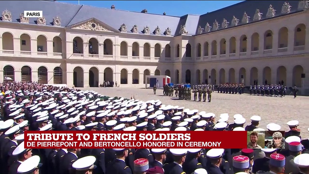 Tribute to French soldiers: coffins are taken away as band sings