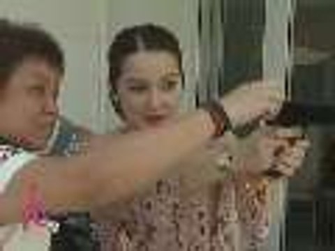 Kim Henares teaches Kris Aquino how to shoot