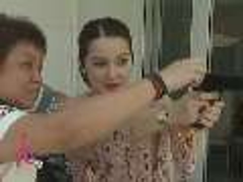 Kim Henares teaches Kris Aquino how to shoot
