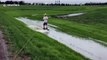 US man pulls off a 360 spin whilst wakeboarding in a flooded ditch