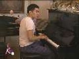 Josh plays the piano while Karla sings