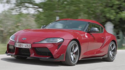 Toyota GR Supra in Red Driving on the road