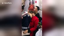 'Mum needs a rest' Sweet Chinese boy holds up napping mother on train