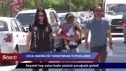 Reçeteli hap satan kadın yüzünü çocuğuyla gizledi