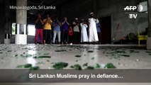 Defiant Sri Lankan Muslims pray inside destroyed mosque