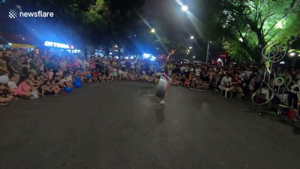 Like a human slinky! Woman able to spin dozens of metal hoops on her body