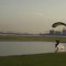Skydiving Guy Lands Expertly Swooping Over Water