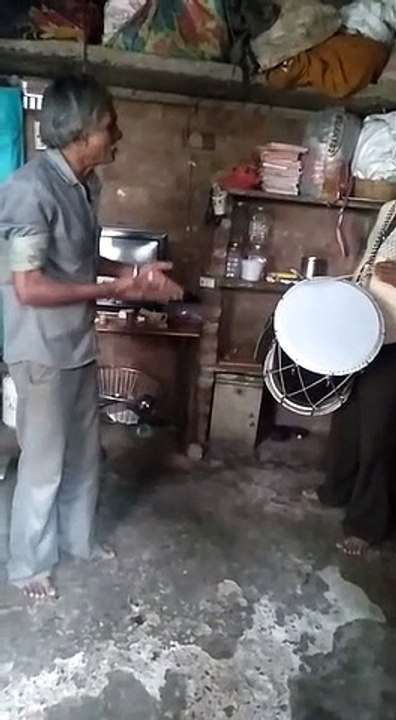 celebration with man working with drummer for the song but not quite working perfectly...do I drum while you sing? fun!