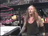 Undertaker Chokeslams Triple H trough Announce Table