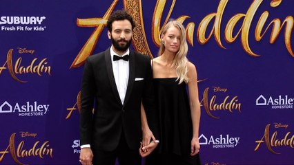 Marwan Kenzari and Nora Ponse "Aladdin" World Premiere Purple Carpet