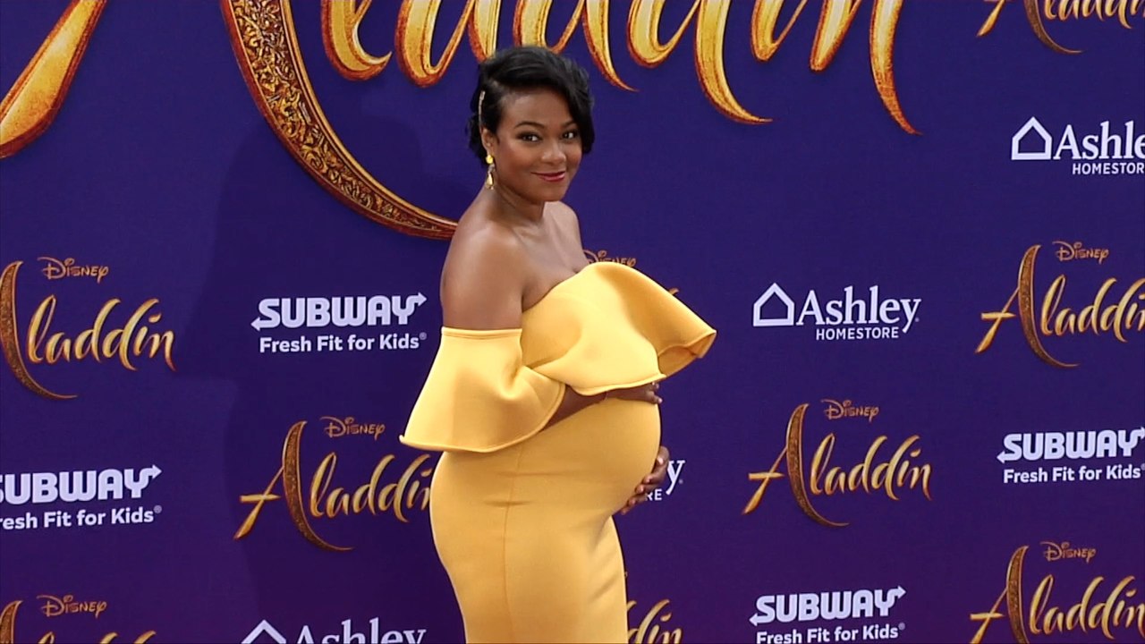 Fresh Prince of Bel-Air star and pregnant Tatyana Ali at Aladdin world premiere in LA