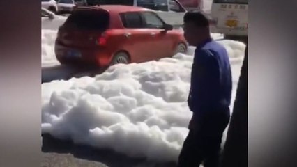 White foam bursts out of manholes, submerging streets in Xian
