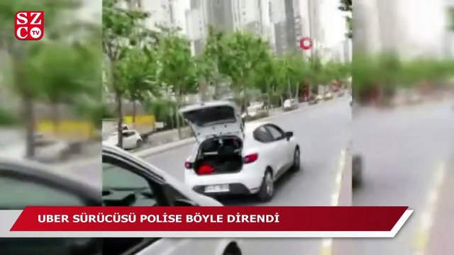 UBER sürücüsü aracını üzerine çıkarak, bağlamayın diye polise direndi
